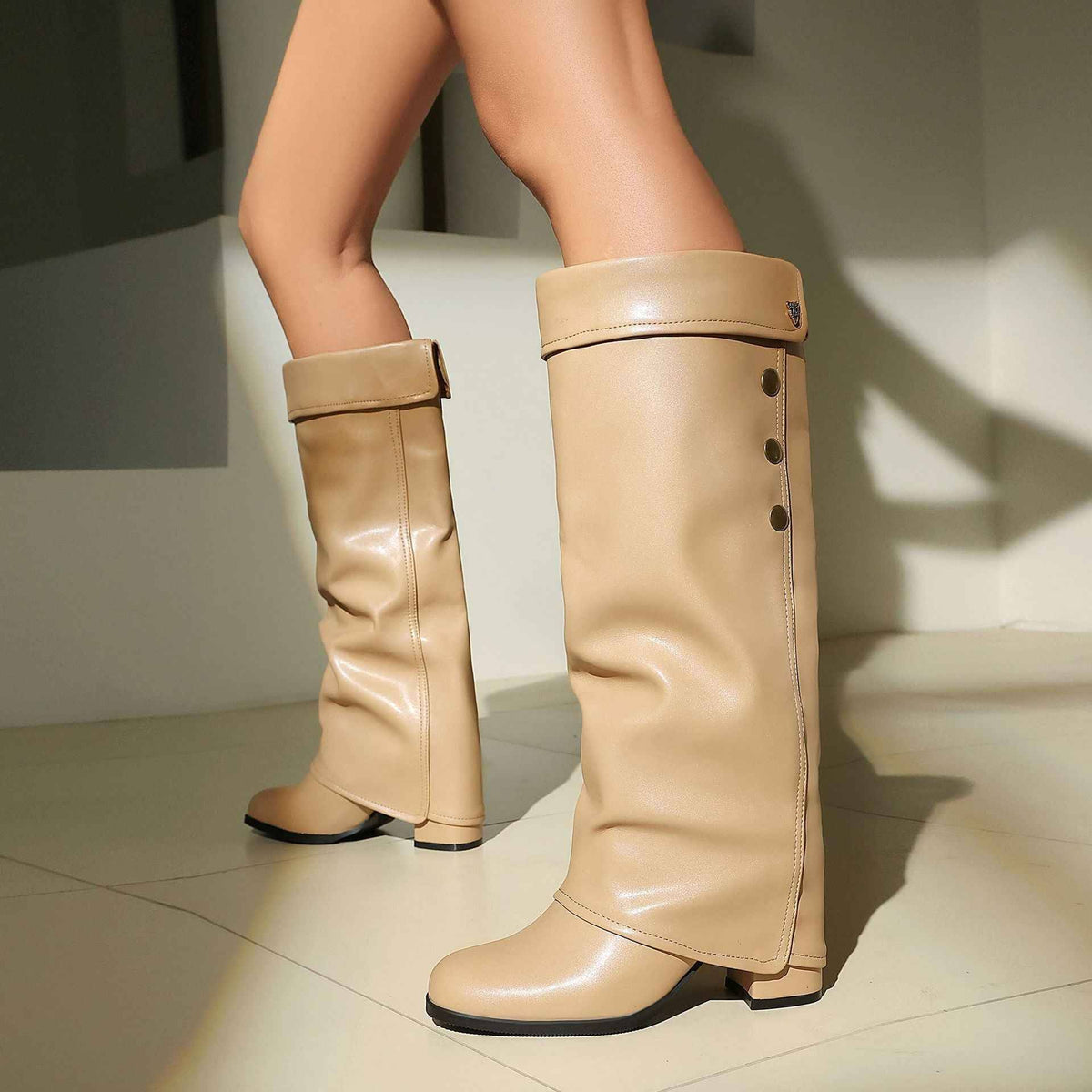Women's Chunky Heel Knee-High Boots with Buckle Detail.