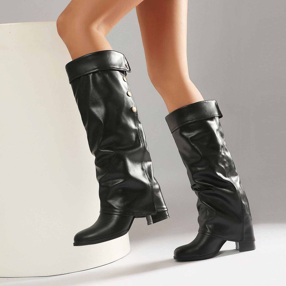 Women's Chunky Heel Knee-High Boots with Buckle Detail.